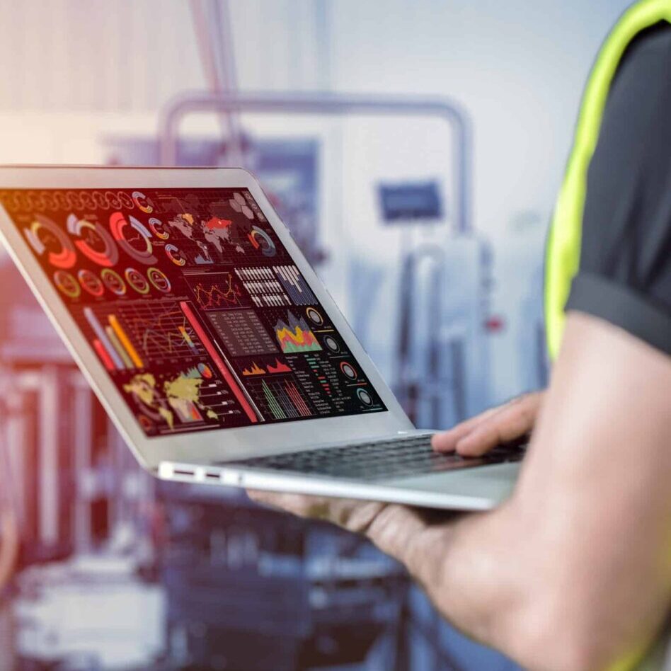 engineer using laptop computer to monitor